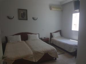 Postel nebo postele na pokoji v ubytování Hotel El Layeli