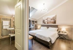Posteľ alebo postele v izbe v ubytovaní Hotel Il Corazziere + 37 fotografií