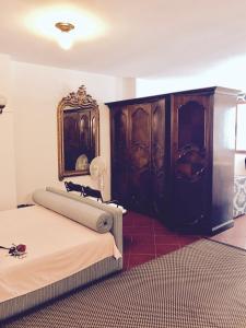 En eller flere senger på et rom på Carraresi Room