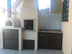 A kitchen or kitchenette at Residencial Mailai