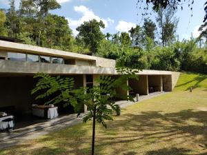 a house with a garden in front of it at Santani Wellness Kandy in Kandy