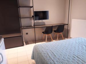 Телевизор и/или развлекательный центр в 4 Seasons Luxury Apartments