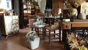 a room with a table and chairs and a desk at Fonda Felip in Port de la Selva