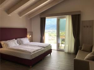 Posteľ alebo postele v izbe v ubytovaní Maso Tobel Riva del Garda