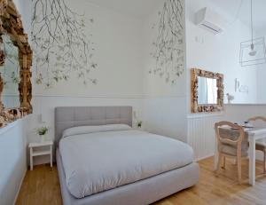 Posteľ alebo postele v izbe v ubytovaní Primo Piano Suites
