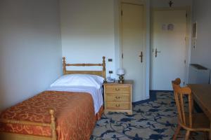 Tempat tidur dalam kamar di Hotel Girasole