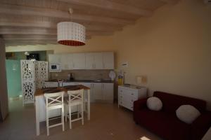 a kitchen and living room with a table and a couch at Loft Sunset View, Costa Adeje in Adeje