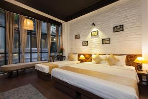 Ένα ή περισσότερα κρεβάτια σε δωμάτιο στο Luxury Backpakers Hotel
