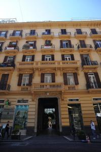 a large building with a tunnel in front of it at B&B Residenza Via Dei Mille in Naples