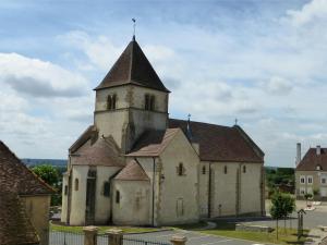 an old church with a tower on a street at Chez Casimir in Cercy-la-Tour +35 photos