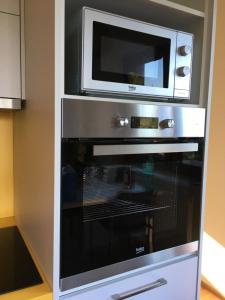 Kuchyň nebo kuchyňský kout v ubytování Apartmány Pinie Lipno