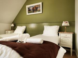 Uma cama ou camas num quarto em Hotel Apartments Belgium II