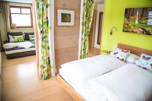 Ein Bett oder Betten in einem Zimmer der Unterkunft Qi Gong Haus