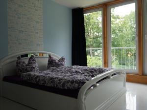 Cama o camas de una habitación en Ferienwohnungen Thüringer Wald