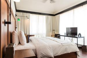 Postel nebo postele na pokoji v ubytování American Trade Hotel