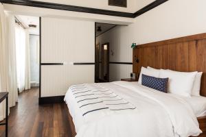 Postel nebo postele na pokoji v ubytování American Trade Hotel