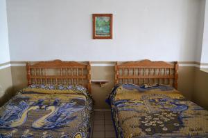 Postel nebo postele na pokoji v ubytování Hotel Plaza Romo
