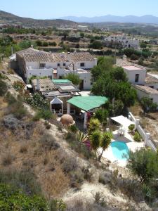 an aerial view of a house with a swimming pool at Almond Reef Casa Rural in Los Alias