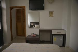 Hotel Anapoima客房内的一张或多张床位