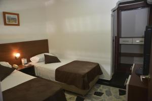 Hotel Anapoima客房内的一张或多张床位