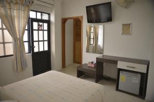 Hotel Anapoima客房内的一张或多张床位