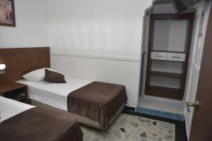 Hotel Anapoima客房内的一张或多张床位