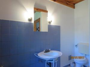 a bathroom with a sink and a toilet at Molnárporta in Szentgyörgyvölgy +78 photos
