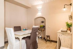 a dining room with a table and chairs at Borgo San Gaetano in Bernalda