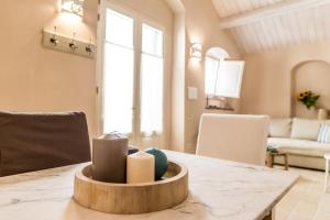 a dining room with a table with candles on it at Borgo San Gaetano in Bernalda