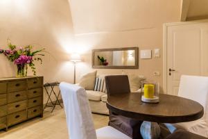 a living room with a table and a couch at Borgo San Gaetano in Bernalda