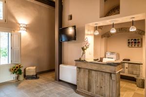 a bathroom with a vanity and a tub and a sink at Borgo San Gaetano in Bernalda