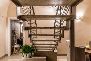 a spiral staircase in a living room at Borgo San Gaetano in Bernalda