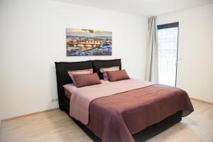 Posteľ alebo postele v izbe v ubytovaní Garden Towers Apartments