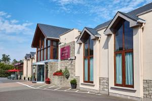 a row of buildings on a street at The Farmers Kitchen Hotel in Wexford