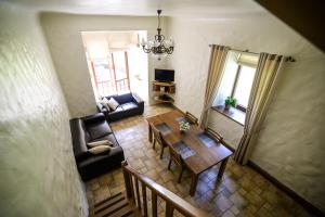an overhead view of a living room with a table and couch at Mednieku Namiņš in Sigulda