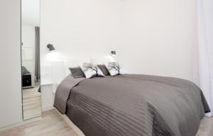 Łóżko lub łóżka w pokoju w obiekcie Apartament Towarowa Kolobrzeg