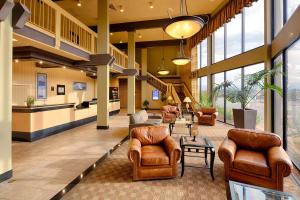 a lobby with couches and chairs in a building at Red Lion Hotel Redding in Redding