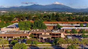 an aerial view of a resort with mountains in the background at Red Lion Hotel Redding in Redding