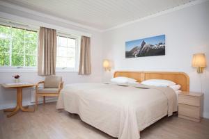 Postel nebo postele na pokoji v ubytování Stetind Hotel
