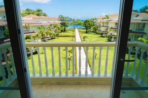 a view from the balcony of a condo at 3BR / 3BA Modern Paradise Loft Condo in Gated Community w/ Daily Housekeeping in Sosúa