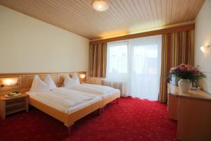 Postel nebo postele na pokoji v ubytování AKTIVHOTEL Weisser Hirsch