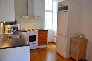 a kitchen with a sink and a stove at Villa Baumgartner in Loviisa