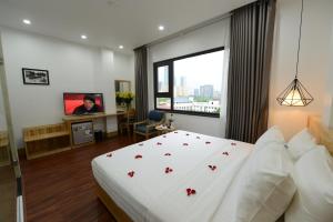 Ένα ή περισσότερα κρεβάτια σε δωμάτιο στο Blue Hanoi Inn City Hotel +45 φωτογραφίες