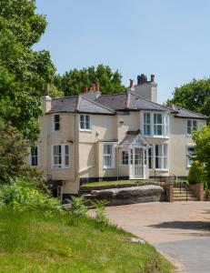 a large house on the side of a road at Mount Edgcumbe in Royal Tunbridge Wells