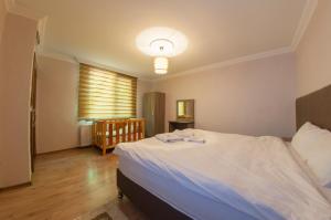 Un pat sau paturi într-o cameră la Boğaziçi Bungalow