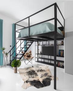 a black bunk bed in a living room at Lazar Apartment in Budapest