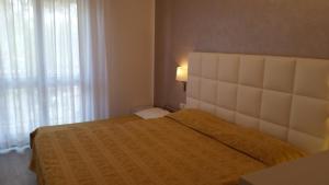 Posteľ alebo postele v izbe v ubytovaní Hotel Acapulco