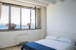 Posteľ alebo postele v izbe v ubytovaní Sunrise Guest House
