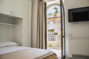 Posteľ alebo postele v izbe v ubytovaní Sunrise Guest House