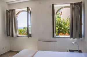 Posteľ alebo postele v izbe v ubytovaní Sunrise Guest House